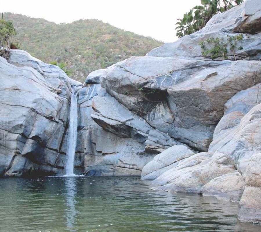 Waterfall and natural swimming pool at Cascada Sol Del Mayo on the Baja California peninsula in Mexico BCS